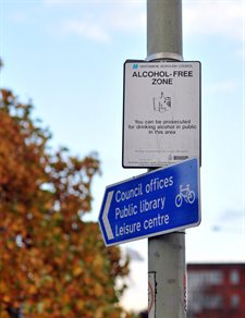 A street sign showing an alcohol free zone