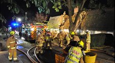 Fire and rescue services tackling a thatch fire