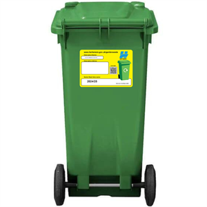green bin with sticker on