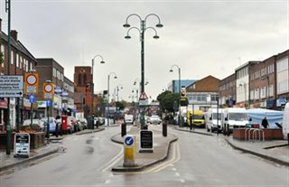 View of Shenley Road shopping parade in Borehamwood, looking towards All Saints Church from the Elstree Studis end