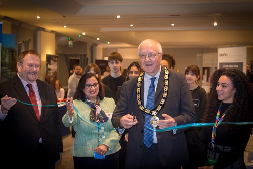 Mayor of Hertsmere cuts a ribbon to open the Generation Hertsmere event.