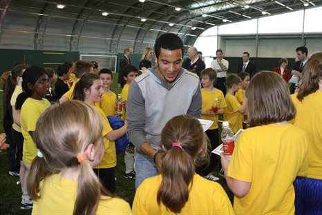 Theo Walcott helps to launch the Arsenal Community programme