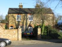 Front view of a house with a car in the driveway