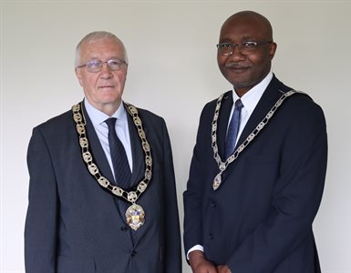 Cllr Graham and Cllr Eni wearing Mayoral chains.