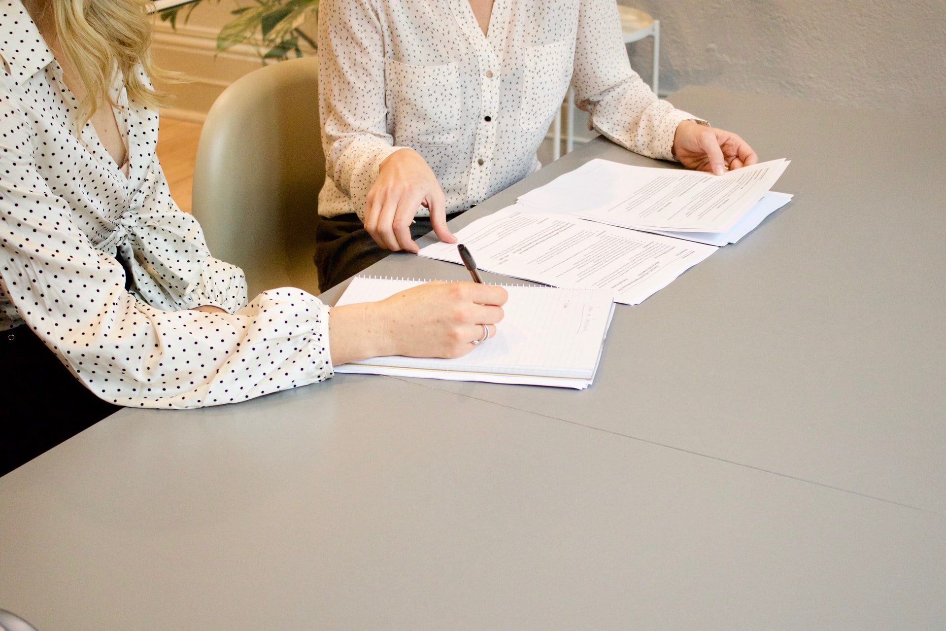 Business women discussing paperwork
