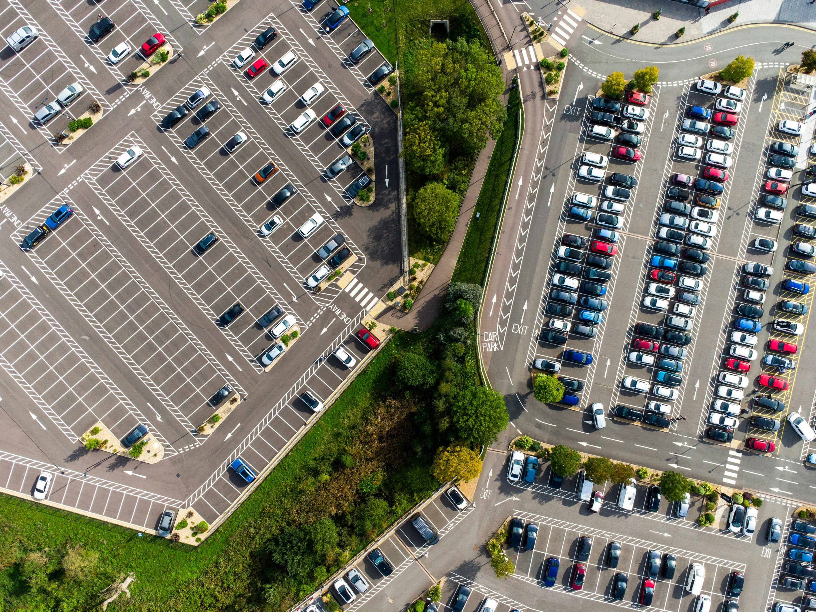 View of parked cars in a car park from a drone view. 