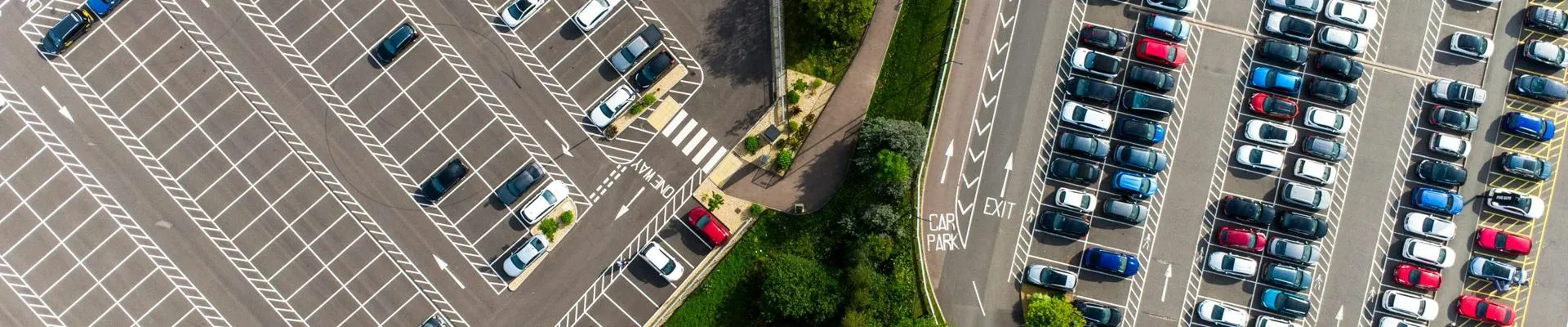 View of parked cars in a car park from a drone view.