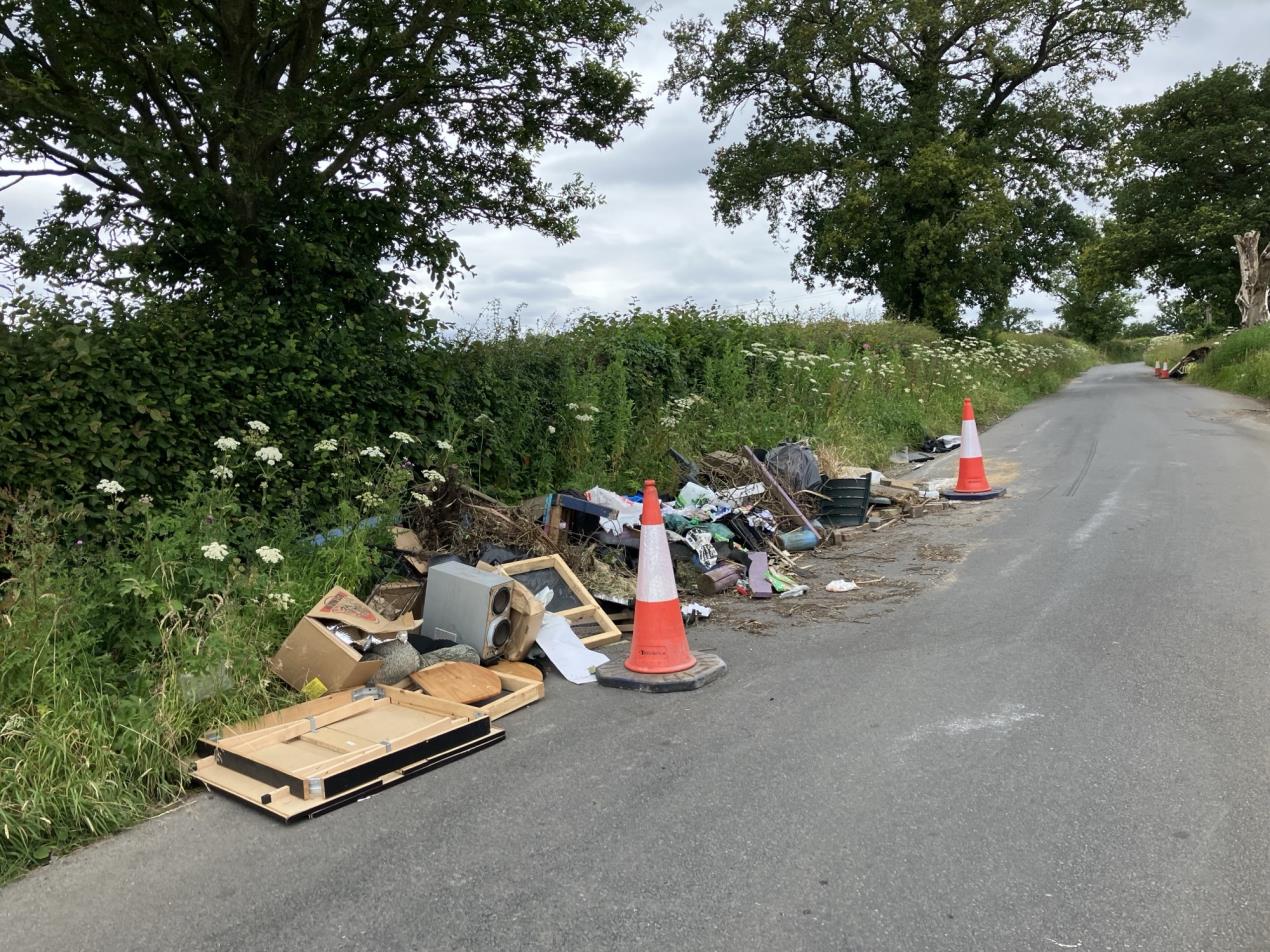 a Fly-tipping incident on the side of a road