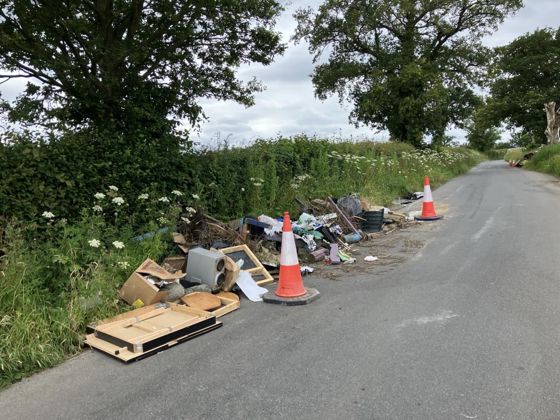 a Fly-tipping incident on the side of a road