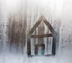 Outline of a house on a window with condensation.