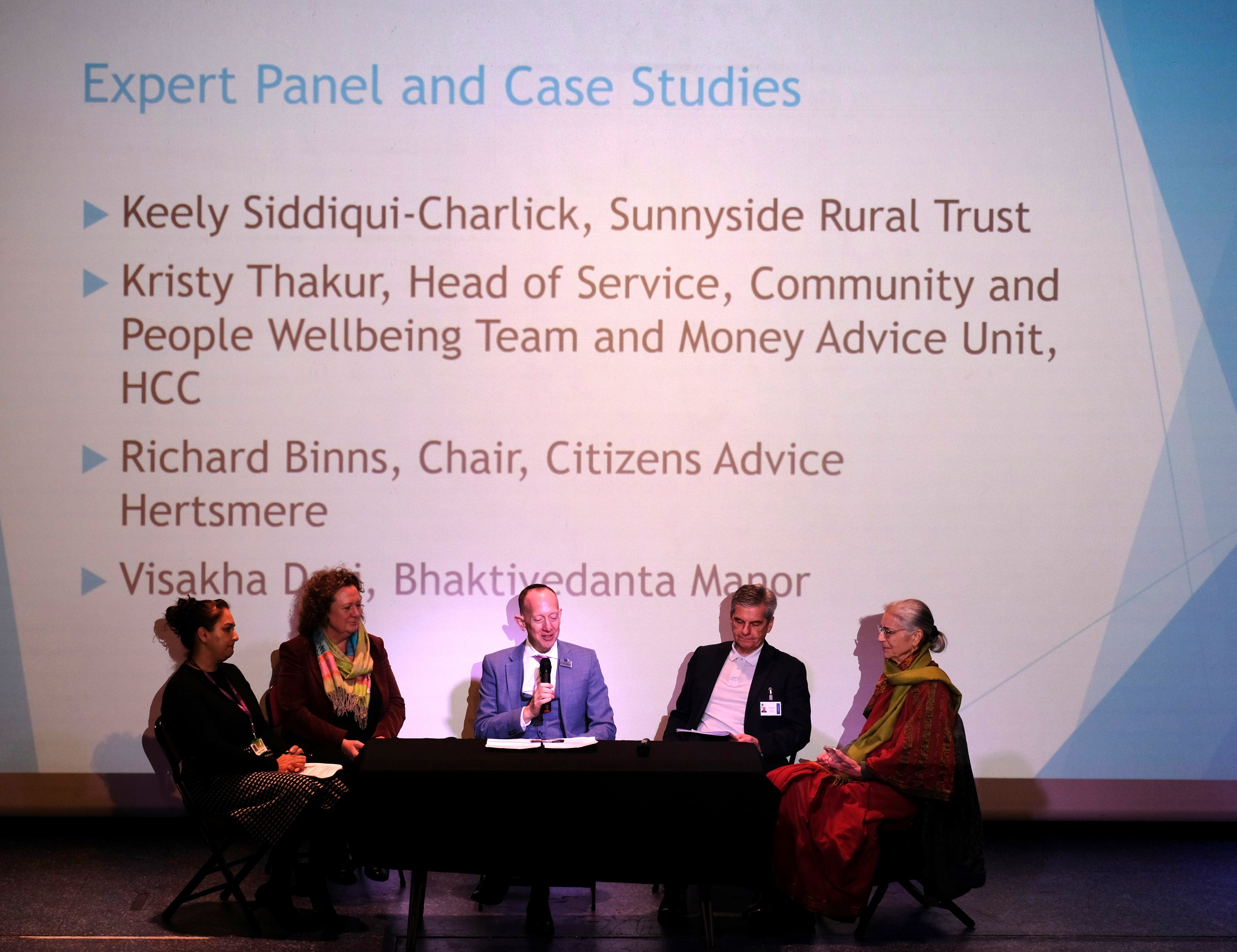 Strengthening Community Connections Conference panel on stage