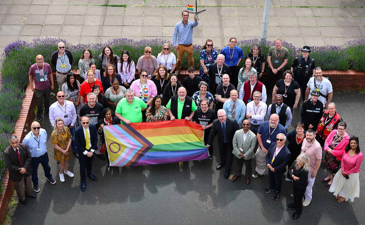 Group shot with Pride flag